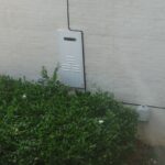 Shrubs block access to tankless water heater