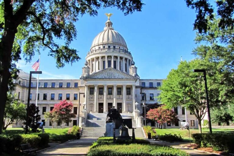 The Arkansas State Capitol building with clear blue skies.
