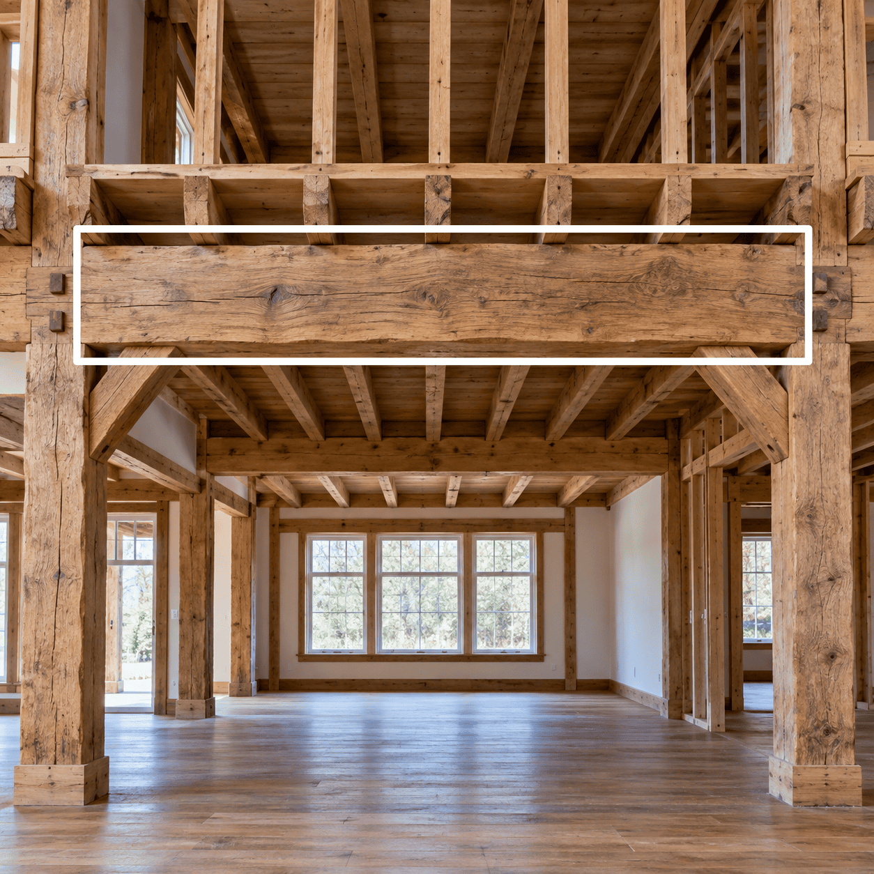 Exposed timber bressumer beam spanning a wide opening in a traditional timber-framed interior.